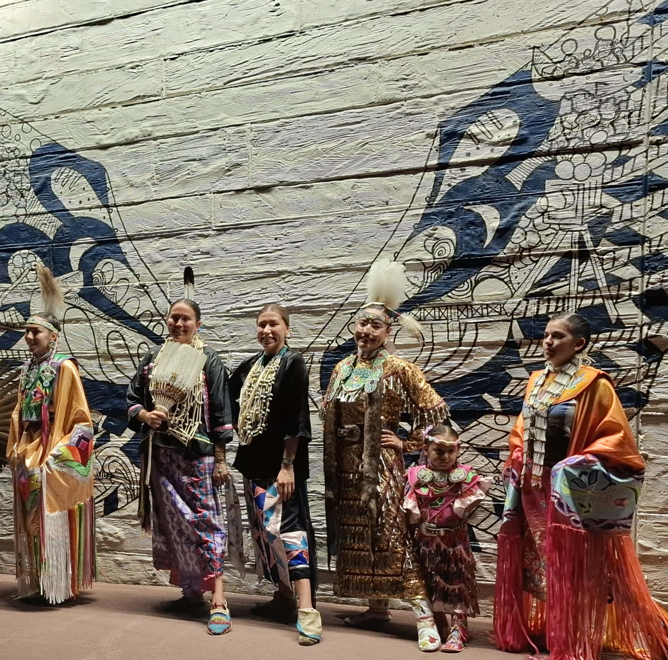 Members of the Little Priest Singers in traditional regalia at Elm Street Plaza